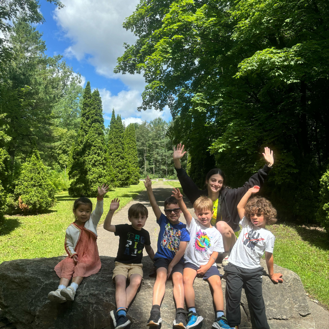 Kids waving on nature walk